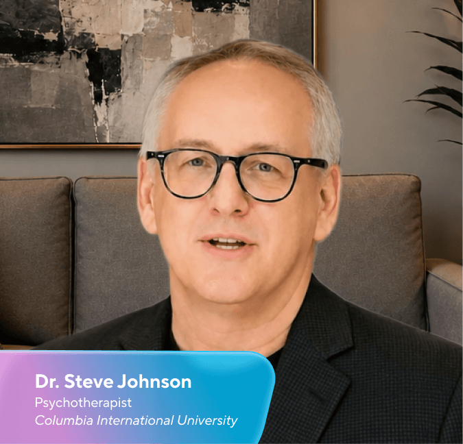 Dr Steve Johnson, a psychotherapist, speaking with his name and title card visible.