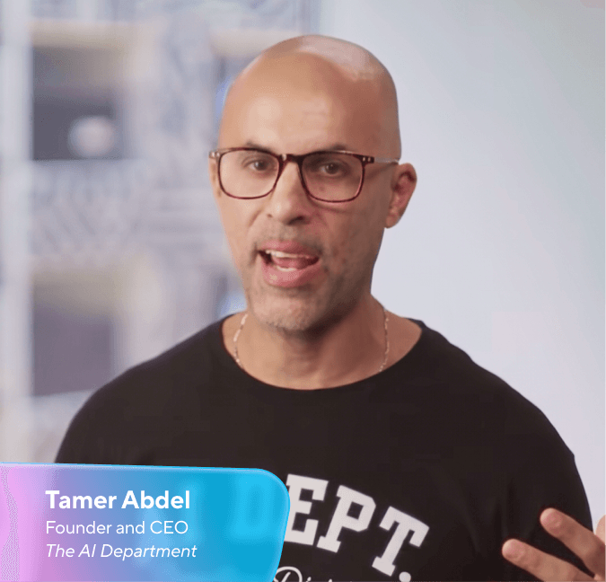 Tamer Abdel, a bald man wearing glasses, speaking.